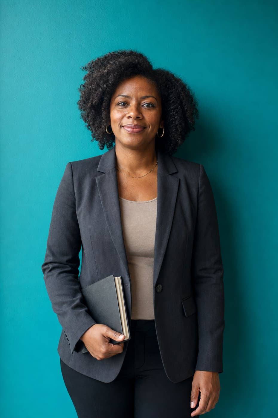 A practitioner holding a closed notebook